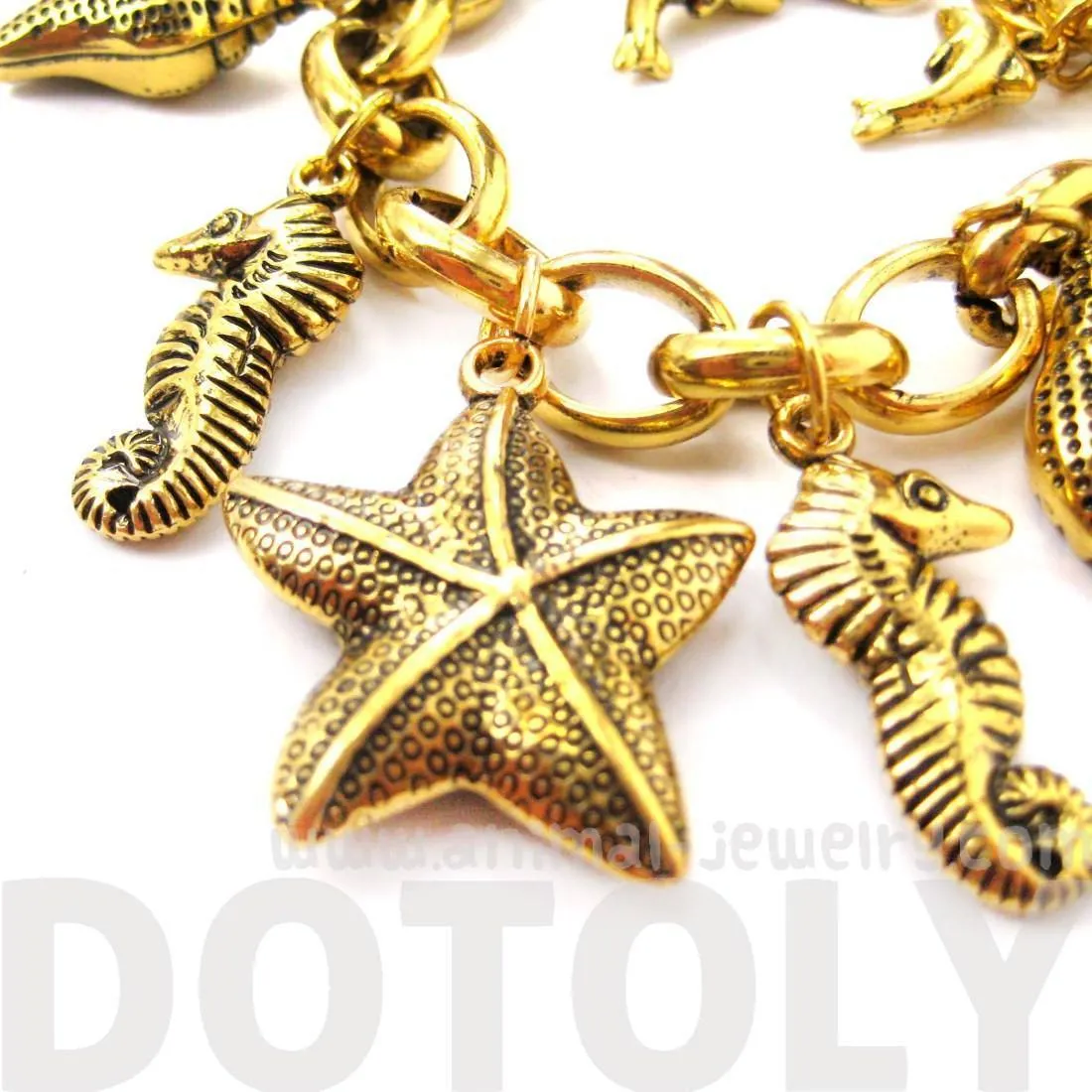 Sea Creatures Themed Charm Bracelet in Gold: Starfish Seahorse Seashell Dolphins